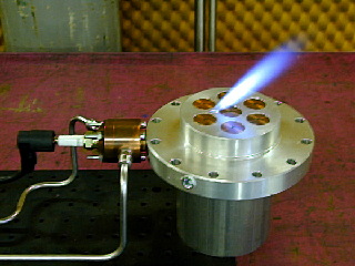 Torch igniter firing through the injector